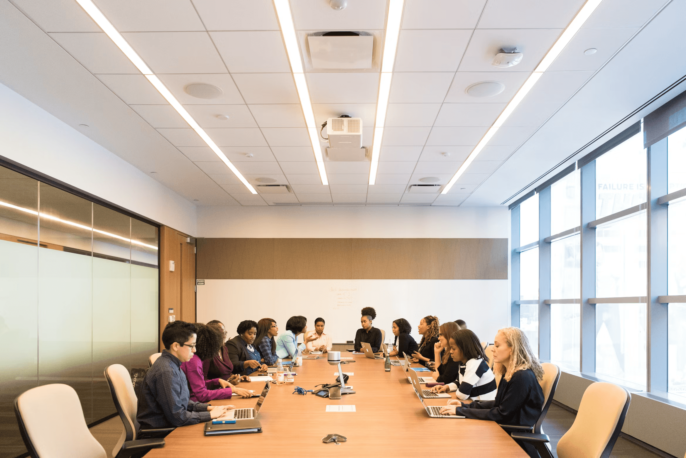 Board of officers in a meeting filling paperwork