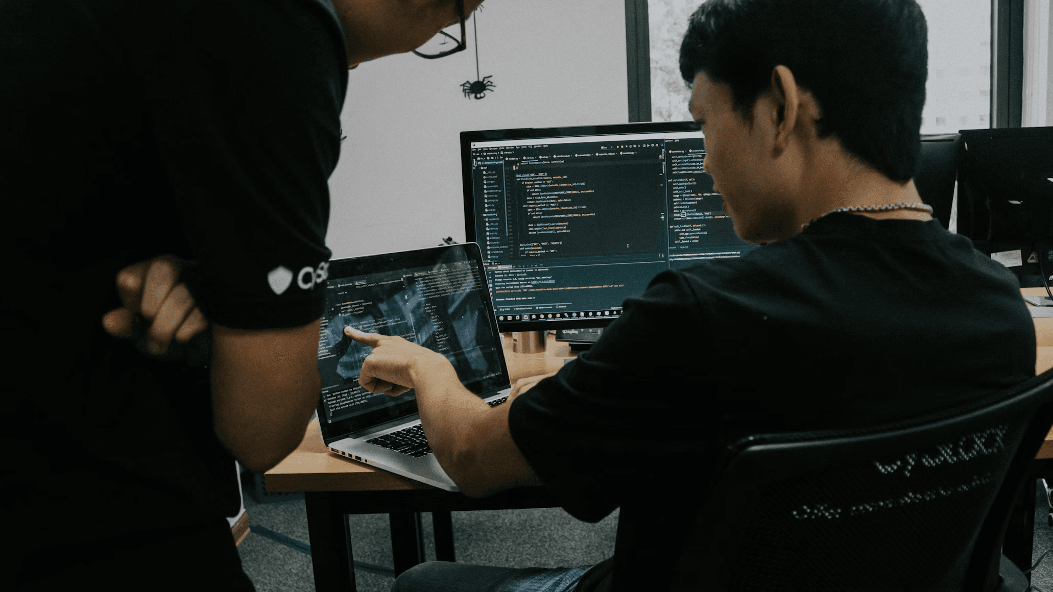 Images of people working on computers in an office setting