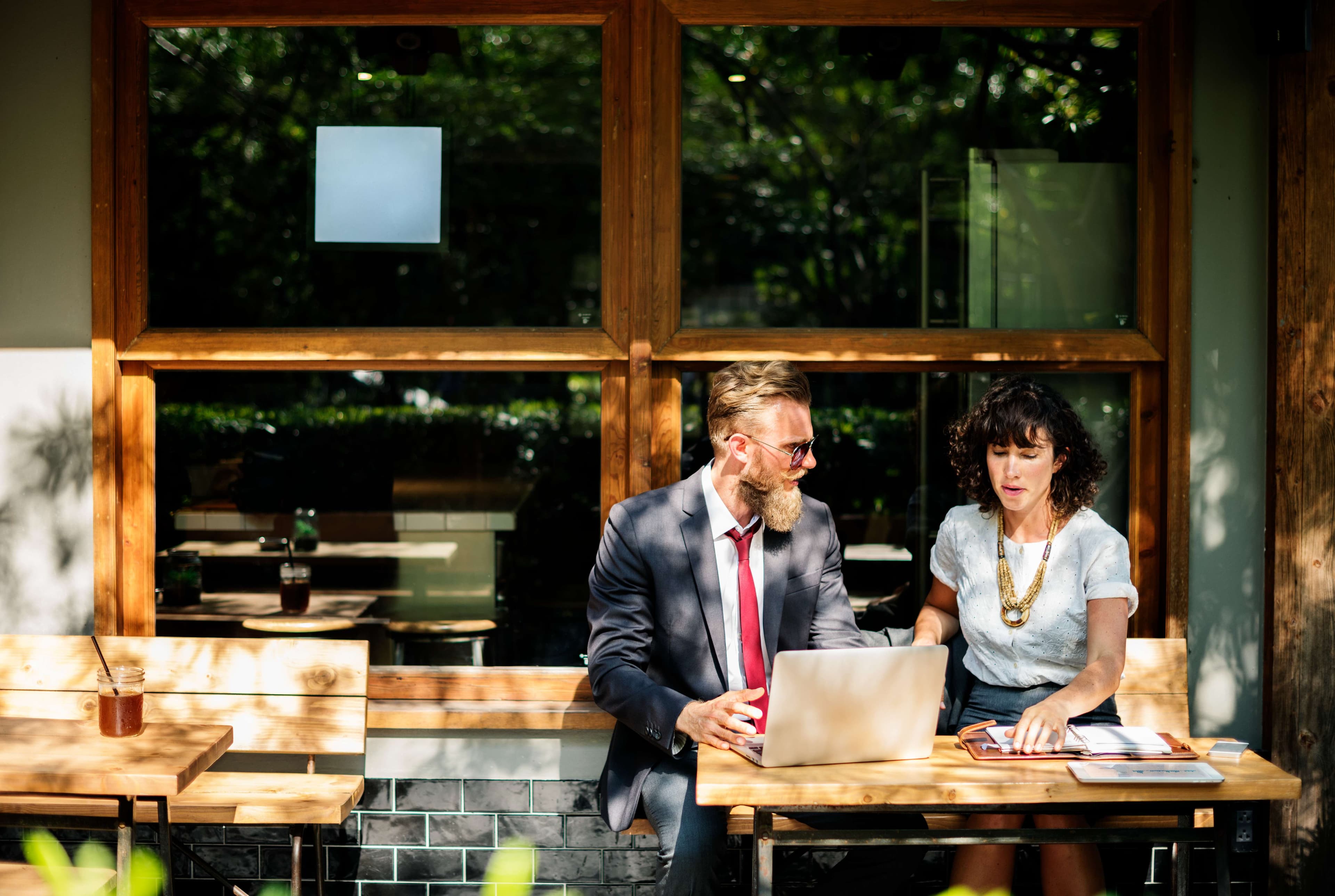 Two people dealing with commercial insurance paperwork